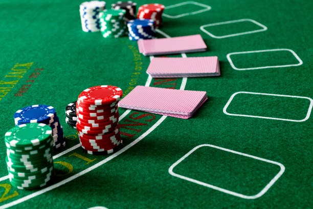 Mobile phone showing ligaplay card games lobby with table selection interface