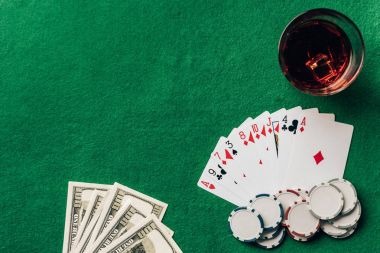 Close-up of baccarat table layout showing Player, Banker, and Tie betting areas